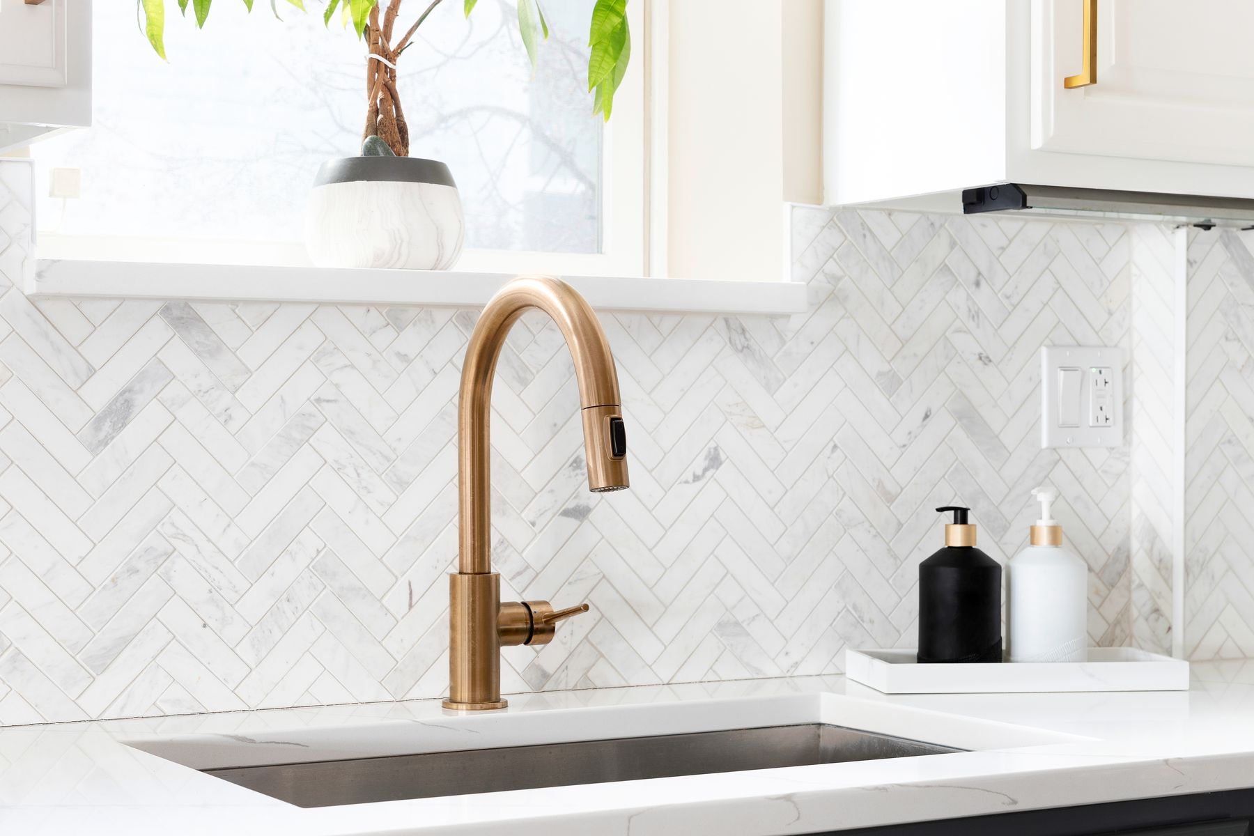 Marble herringbone kitchen backsplash in Fort Walton Beach