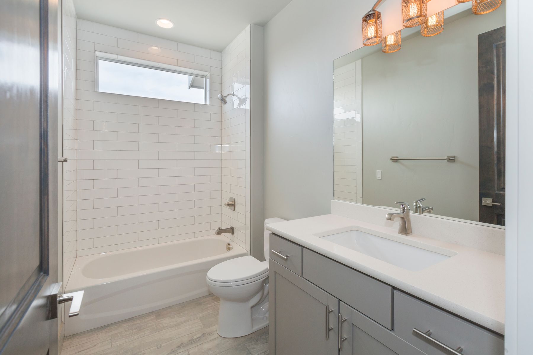 Hall bath remodel with subway tile tub surround