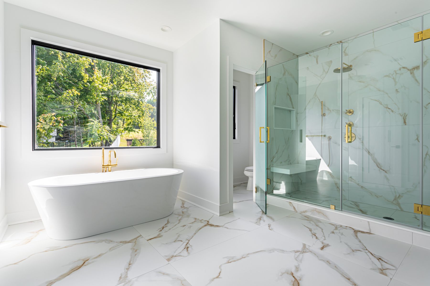 Full bathroom remodel with freestanding tub and marble shower in Fort Walton Beach, FL