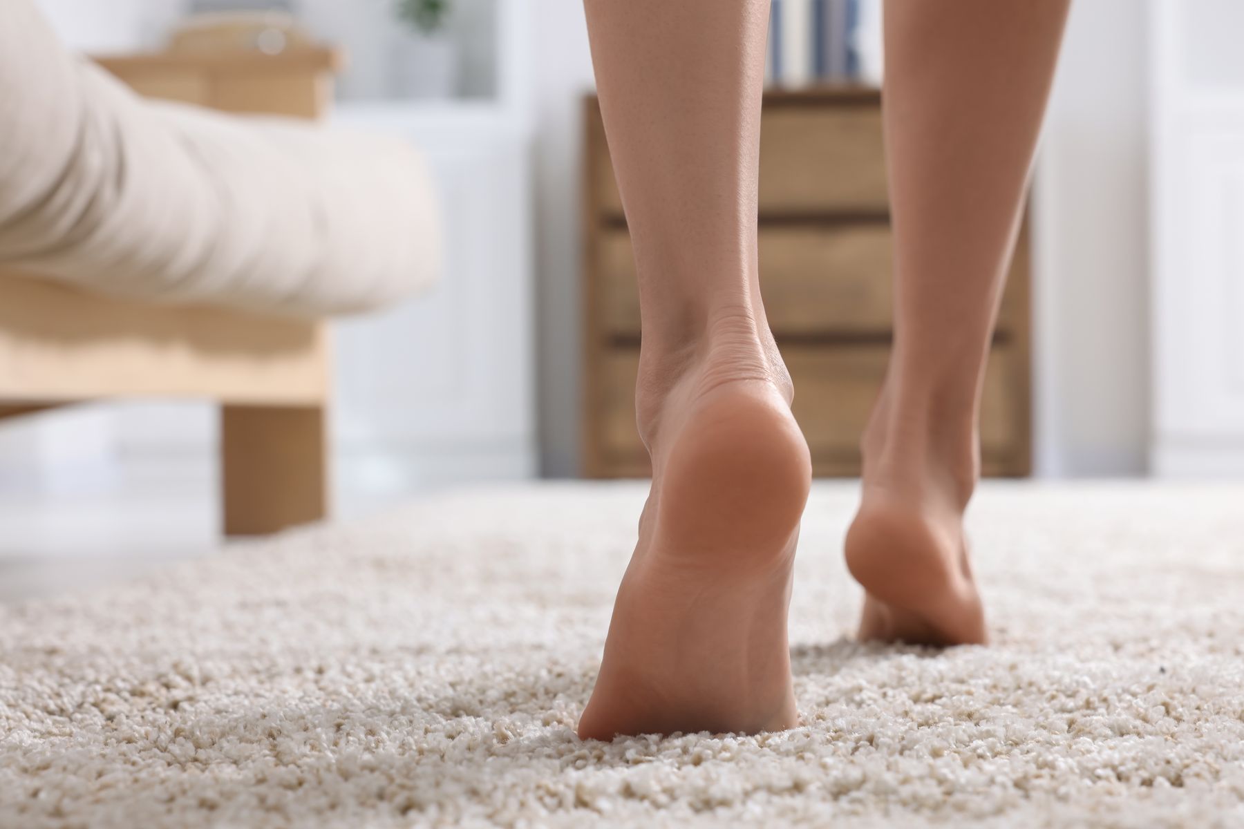 Barefoot on plush carpet