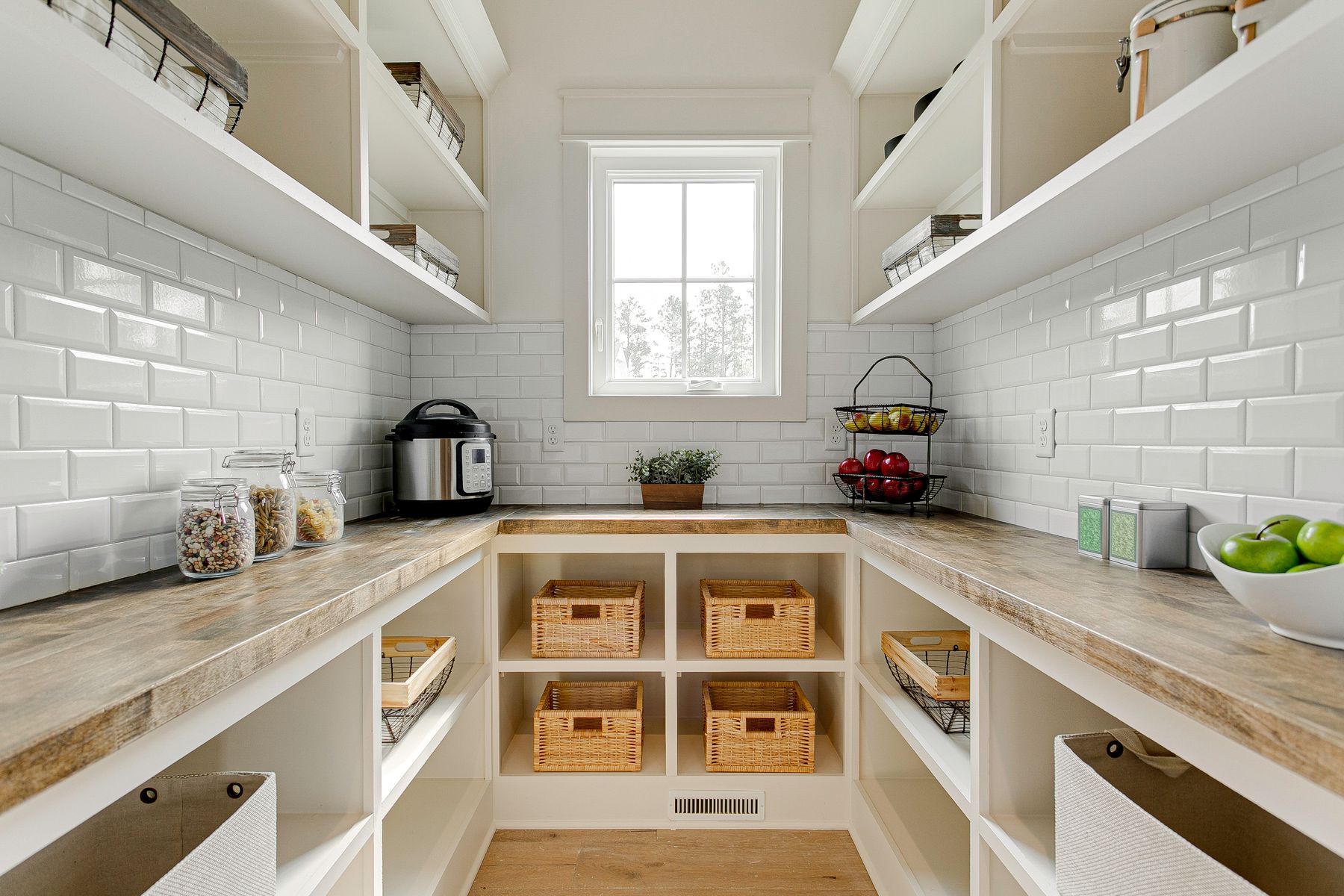 Butler's pantry with subway tile and wood counters in Fort Walton Beach, FL