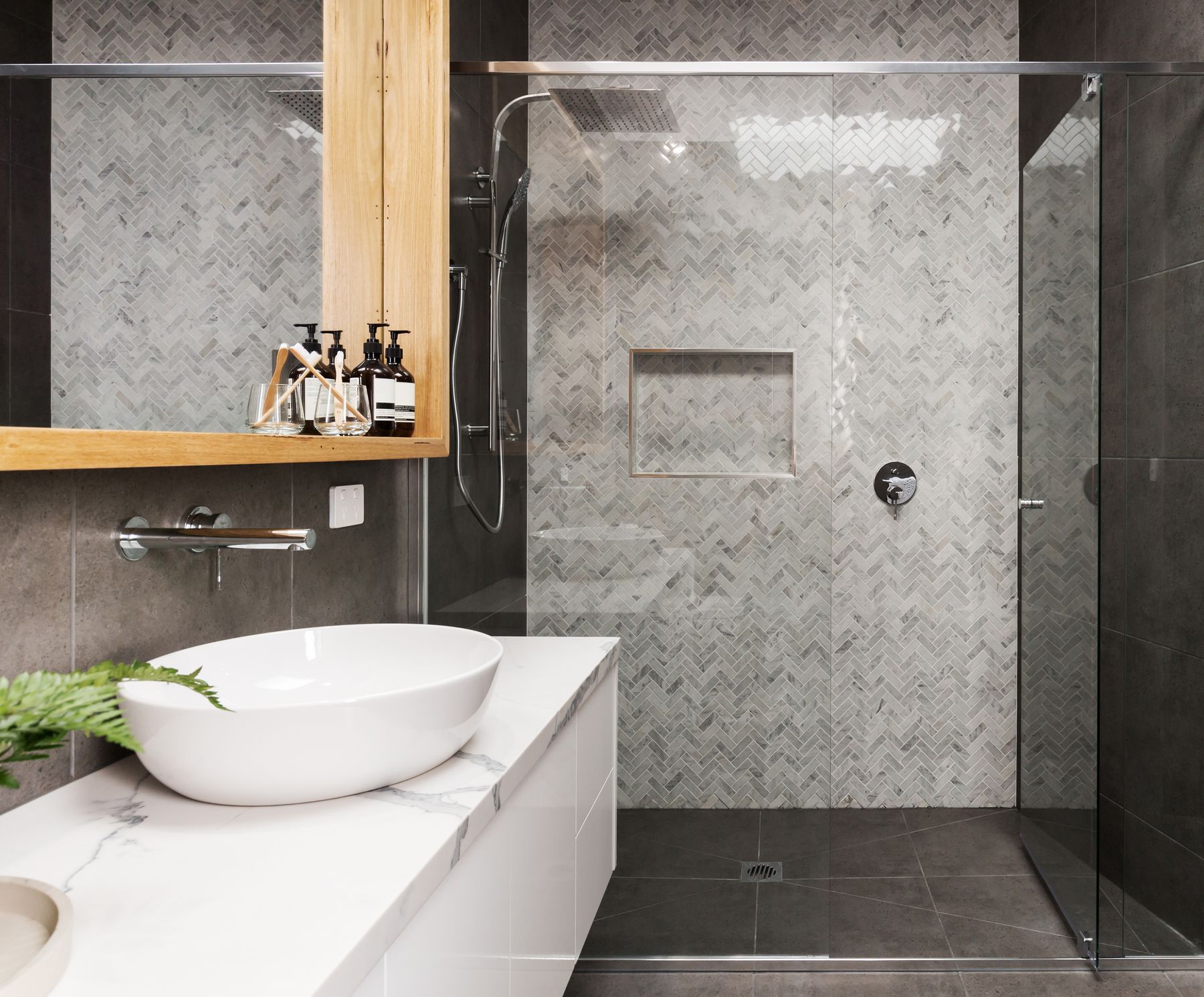 Herringbone marble walk-in shower in Fort Walton Beach, FL