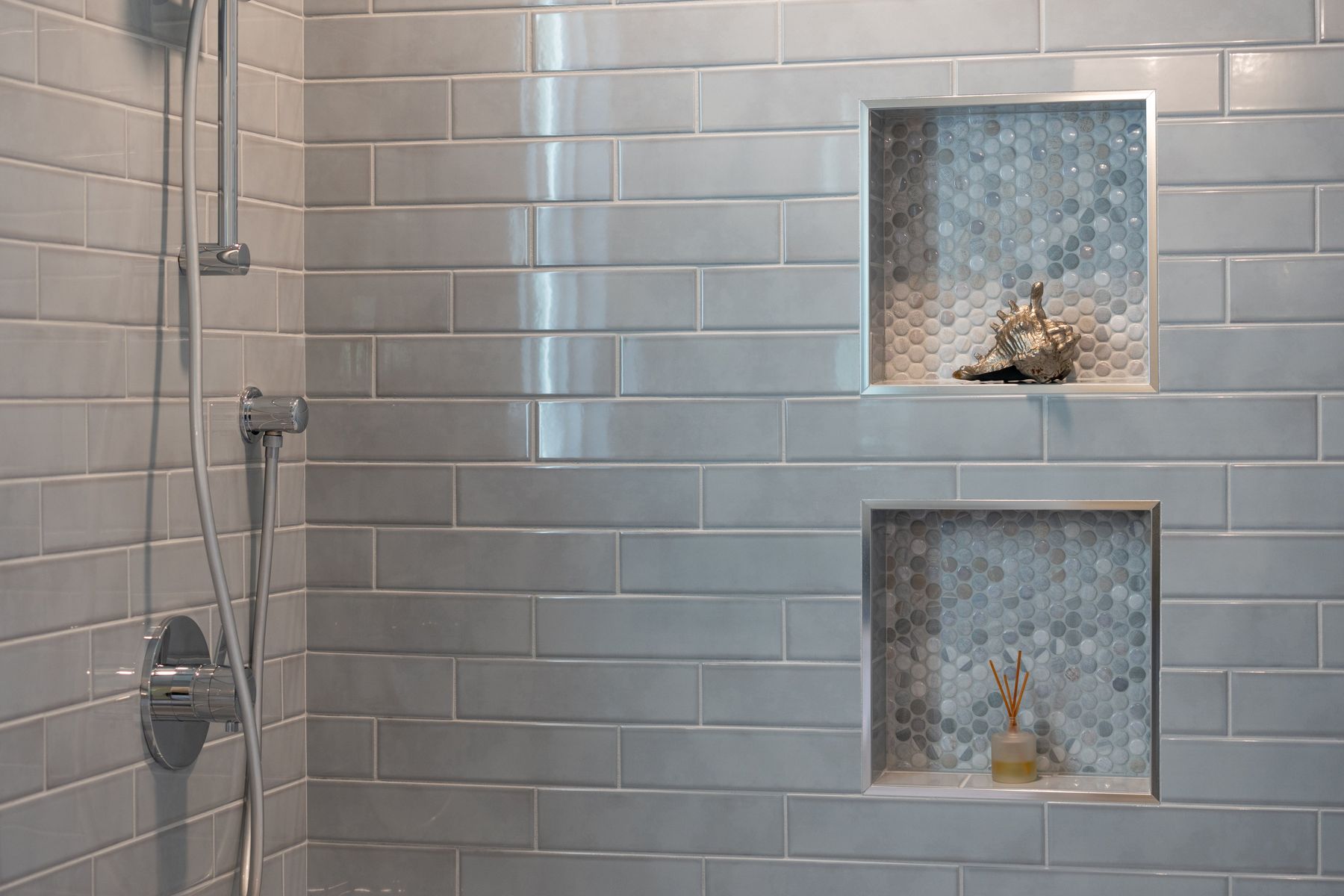 Blue subway tile shower niches