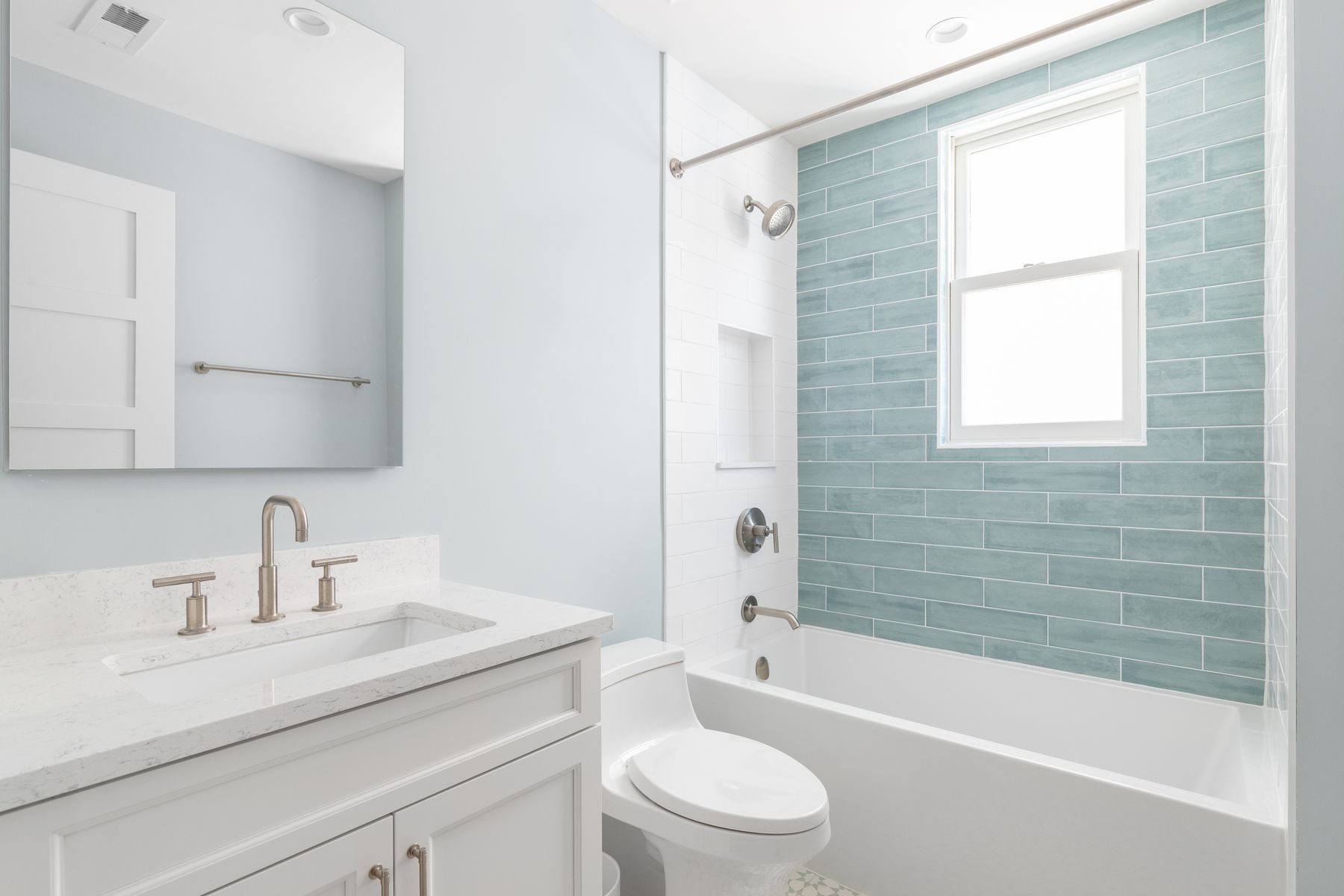 Blue subway tile tub surround in Fort Walton Beach, FL